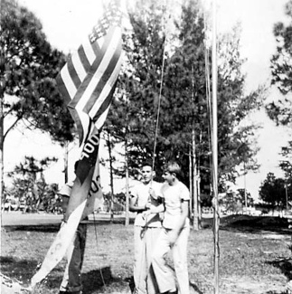 Raising U.S. and troop flags