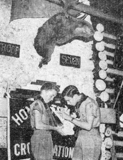 Mitchell Sams, left, getting pointers on coral from Bill Gray
