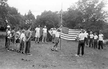 Raising 48 Star U.S. flag at campsite