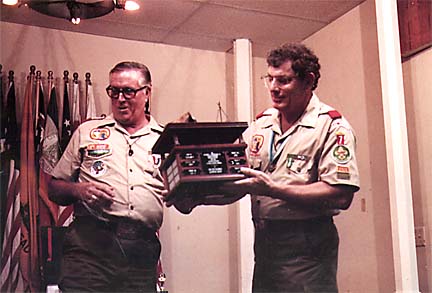 Joe Magruder presenting his camping award to Scoutmaster Tom Dixon in 1982.